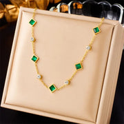 Gold with Green Stones